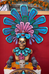 multicolored day of the dead skulls, day of the dead with bones and figures of paper and traditional mexican clay