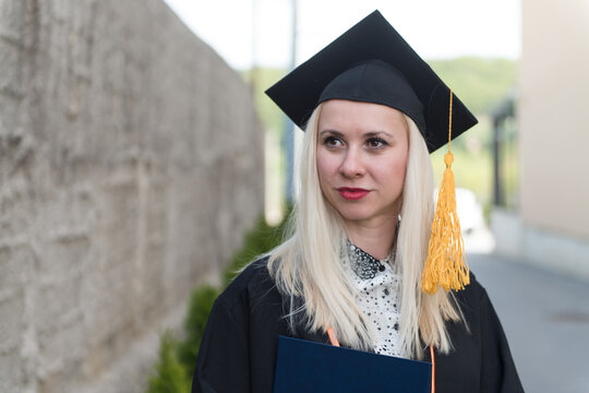 Graduating Student Girl in an Academic Gown