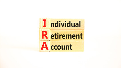 IRA individual retirement account symbol. Concept words IRA individual retirement account on wooden blocks on beautiful white background. Business IRA individual retirement account concept. Copy space