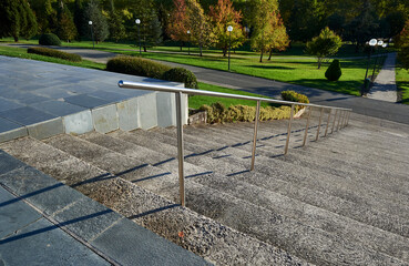 stainless steel handrail on a concrete staircase