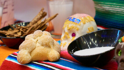 Mexican offering (ofrenda) with all the elements that make up the altar to the dead in Mexican customs, bread, fruits, drinks, flowers