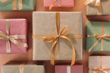 Holiday background made of wrapped and decorated gift boxes. Top view, Christmas pattern.