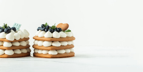 Layered naked cakes with cream cheese filling decorated with blueberries on top. Birthday homemade...