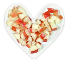 Heart Health Concept - Chopped Red Apples on Heart Shaped Plate