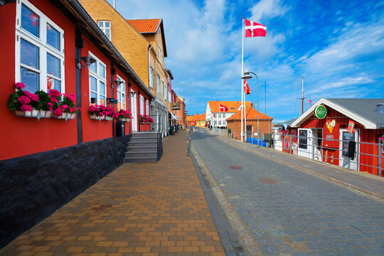 Traditional colorful half-timbered houses in the narrow, cobbled street on the Baltic Sea coast in Allinge , Bornholm, Denmark