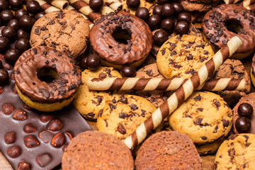 Beautiful chocolate, doughnuts, chocolate stick, and chocolate chip cookies background