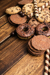 Beautiful chocolate, doughnuts, chocolate stick, and chocolate chip cookies background