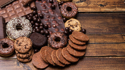 Beautiful chocolate, doughnuts, chocolate stick, and chocolate chip cookies background