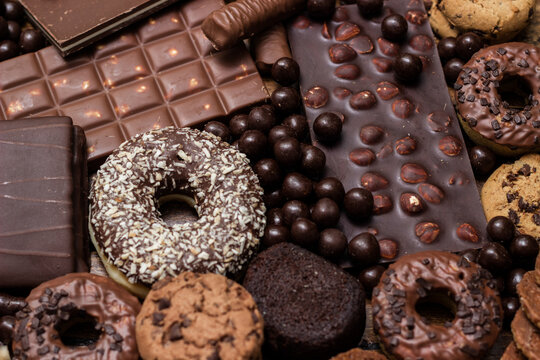Beautiful chocolate, doughnuts, chocolate stick, and chocolate chip cookies background