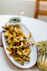 sliced yellow roasted squash on long platter