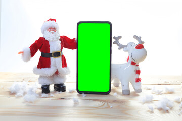 Christmas pedestal with phone chromakey still life with a Christmas card with Santa and a deep