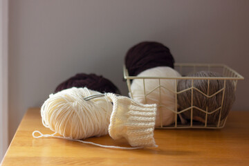 skeins and knitting needles close-up. yarn, hobby, leisure