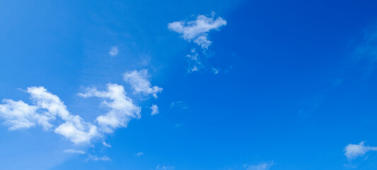 Blue sky and light clouds. Wide photo.