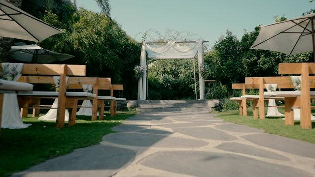Chuppah in a beautiful garden. High quality FullHD footage