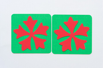 two red on green paper asterisks 