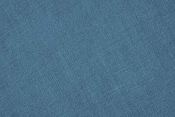 Fototapeta na wymiar Blue woven surface closeup. Linen textile texture. Fabric handicraft background. Textured braided backdrop. Len wallpaper. Macro