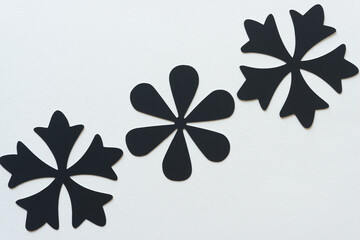 background with three black paper asterisk