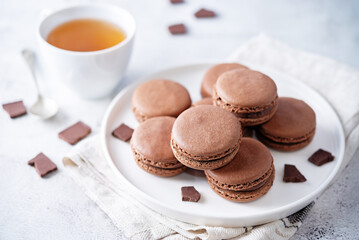 Sweet chocolate macarons with chocolate cream filling - Powered by Adobe