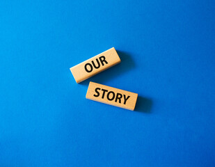 Our story symbol. Wooden blocks with words Our story Beautiful blue background. Business and Our...