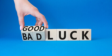 Good Luck and bad Luck symbol. Hand turns a cube and changes the words Bad Luck to Good Luck....