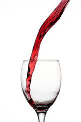 Red wine pouring into glass