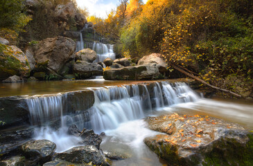 waterfall in autumn forest - 543743446