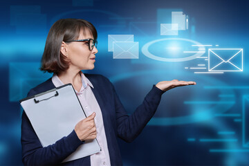 Business mature woman on urban background with mail virtual icons
