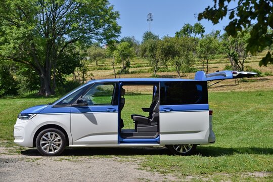 Volkswagen Multivan T7 e-Hybrid. Plug-in hybrid minibus. General side view. 07-17-2022, Prague, Czech Republic.