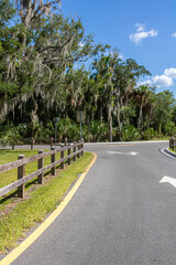 parking lot with a winding road and trees 