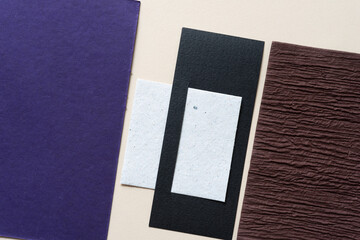 paper background with purple, white, black, and brown elements
