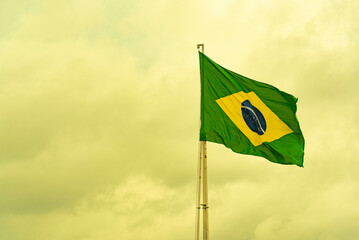 Brazilian flag flying on an iron bar
