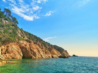 Beautiful shot of the rocky Costa Brava over the water in Spain