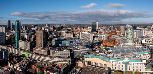 Aerial view of a Birmingham Bullring and New Street Train Station in a cityscape skyline