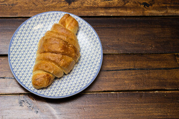 Fresh baked croissant on a plate ready to serve in the morning