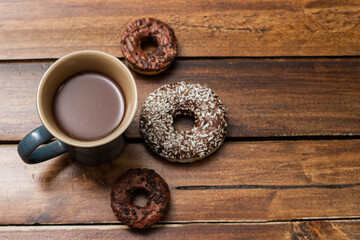 Various chocolate donuts and chocolate milk cup