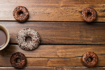 Various chocolate donuts and chocolate milk cup