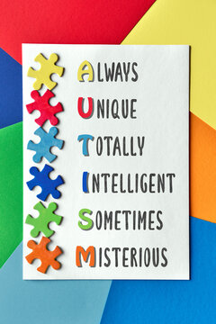 Autism Awareness Day April 2, World Autism Day, frame with puzzle pieces and motivator Acrostic text. Poster design for Health Care Awareness campaign for Autism.
