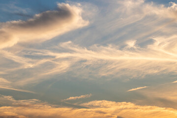 wispy clouds during sunset
