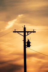 Telephone pole during sunset