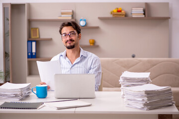 Young businessman employee working from home during pandemic