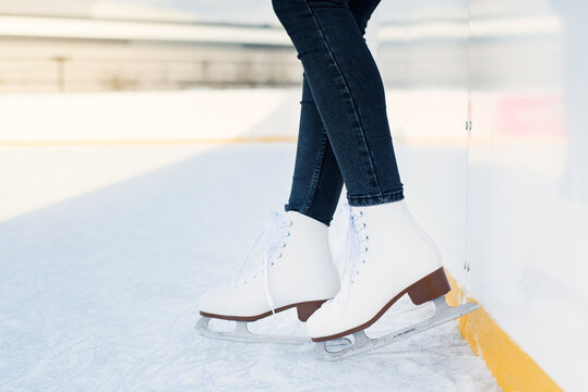 Woman Is Ice Skating On Rink Close Up