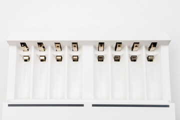 Cells with contacts for charging rechargeable batteries with selective focus and blurred background.