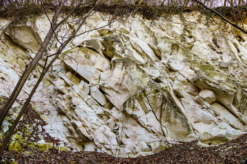 Texture cracked rock formation rock in the wild. Background with copy space