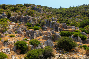 Fototapeta na wymiar The ruins of a sunken ancient city on the island of Kekova Lycian Dolichiste in Turkey in the province of Antalya