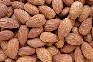 Close up of Peeled almond nuts. Almond full macro shoot nuts as a background. Top view