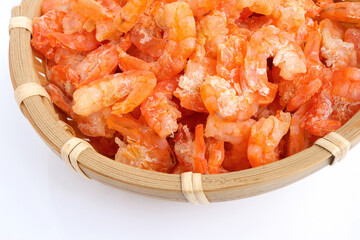 Close up of dry shrimps in the basket. Dried shirmp on the table.Top view