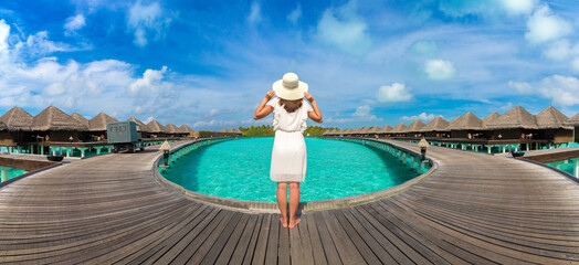 Woman standing on the wooden pier