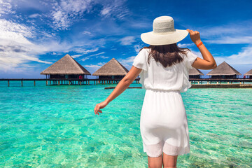Woman standing on the wooden pier