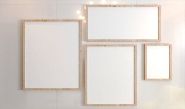 Wood frames collection, four blank frameworks set isolated on white wall, interior decor mock up.