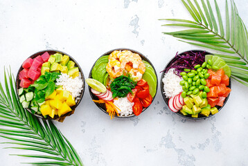 Hawaiian poke bowl set: tuna, salmon, shrimp with avocado, mango, radish, rice and other...